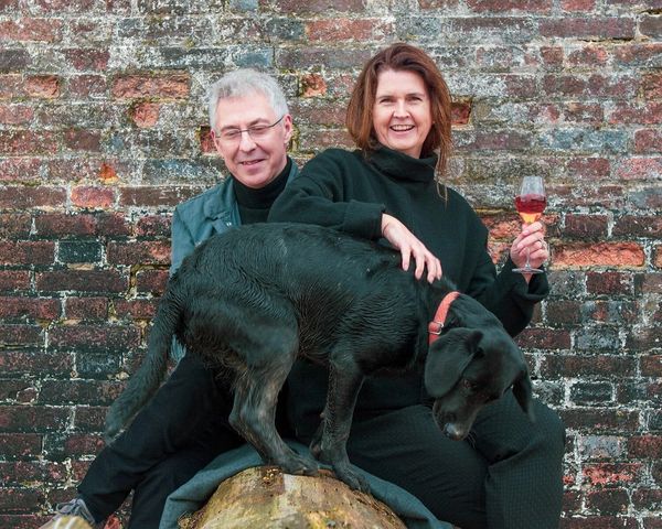 Owners of Artelium, Mark Collins and Julie Bretland, pictured with their dog. 