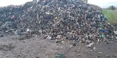 A large pile of garbage outdoors.