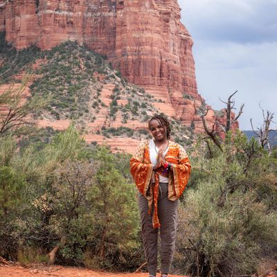 Yoga teacher in front of red rocks in sedona