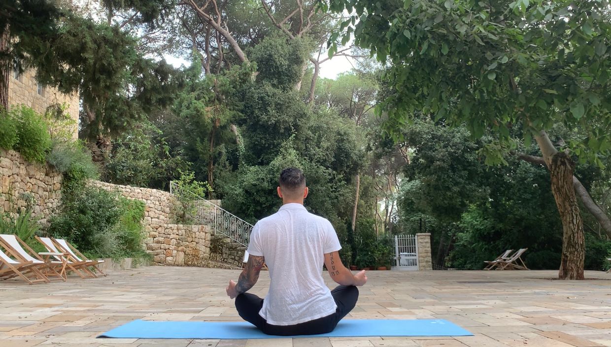 Outdoor meditation session in Lebanon – yoga for stress relief, mindfulness, and wellness coaching.