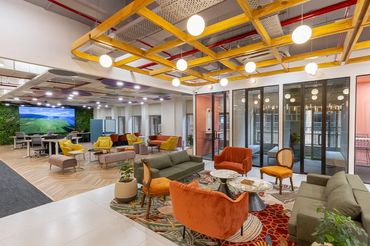 Modern office interior design with ergonomic furniture and collaborative spaces by AAYS Solutions.
