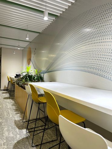 Contemporary sitting lounge in office interior designed for relaxation and collaboration.
