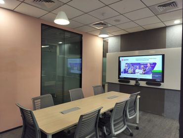 Ergonomic office desks and chairs in a contemporary workstation setup, ideal for corporate interior