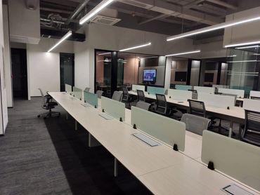 Customized modular workstations for corporate offices, promoting efficient layouts and employee well