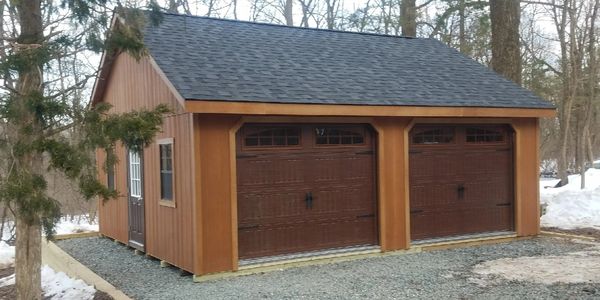 2 car garage with wooden floor 