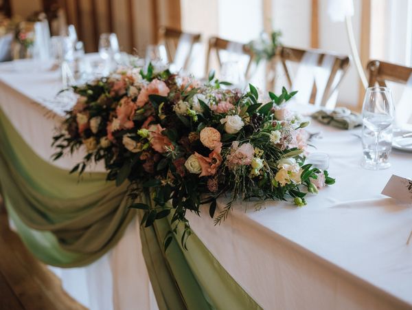 Elegant floral centerpiece on a decorated table.
