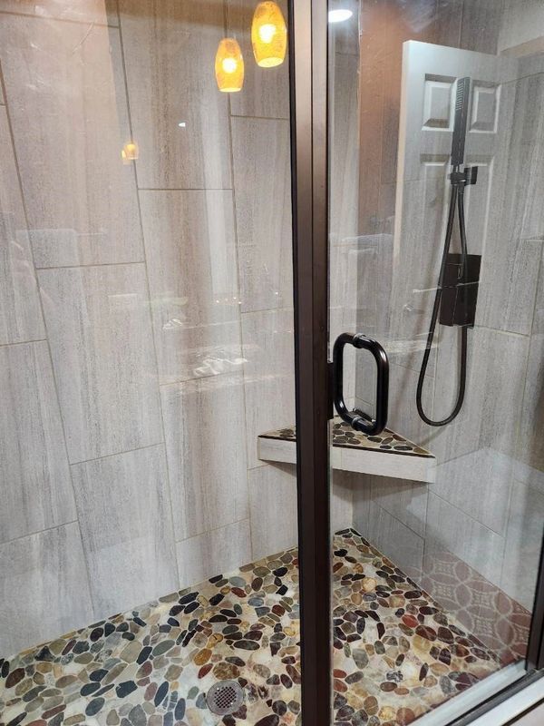 Custom tile shower with glass doors