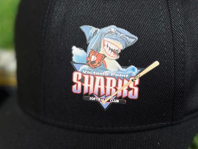 SupaColour digital transfer on a black flexfit cap.  Victoria Point Sharks Softball Club logo.  