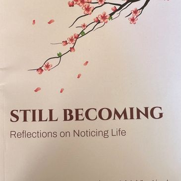 Book cover titled 'Still Becoming' with cherry blossoms.