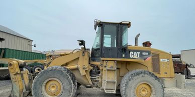 Regal Glass Services installing glass on the loader