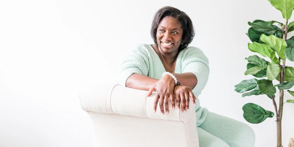 A happy woman on a chair