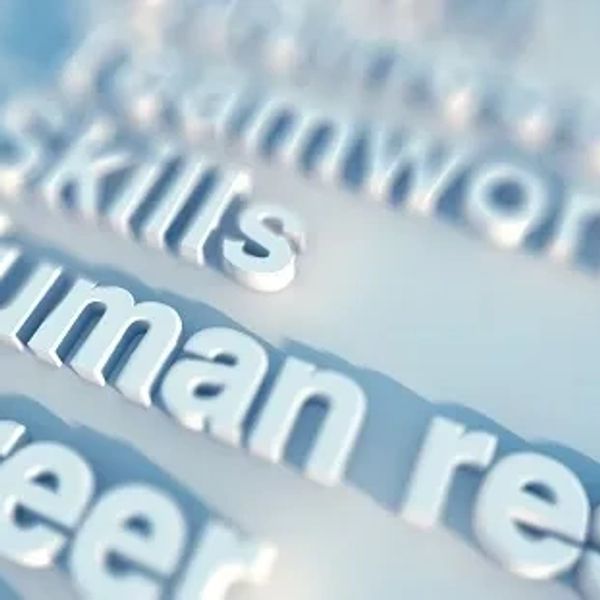 Close-up of 3D words related to career and skills on a blue background.