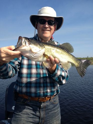 Man holding a large fish he caught.