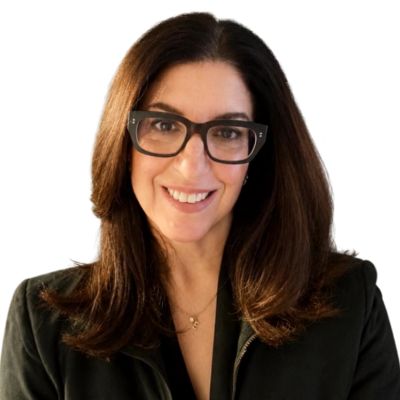 Smiling woman with glasses and brown hair.