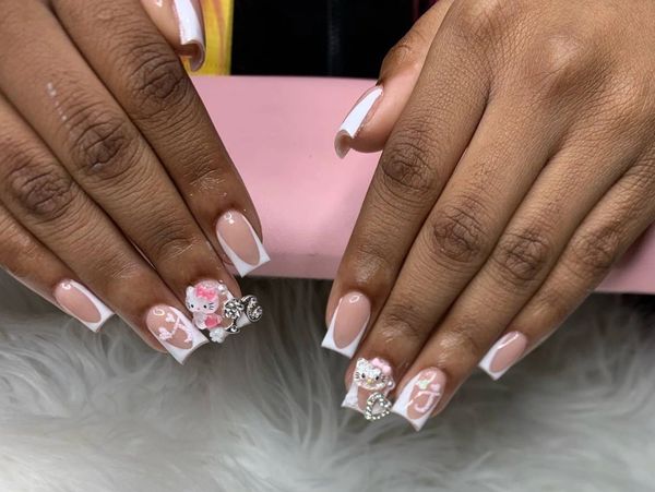 Short white frenchies with initial and charms. 38$ 
Short white French tips w a nude base. Glitter “