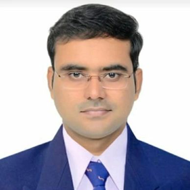 Portrait of a man wearing glasses and a formal suit.