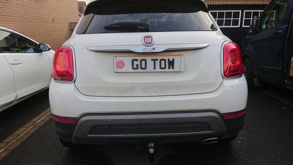 White 500X fitted with a fixed Tow-Trust Tow Bar