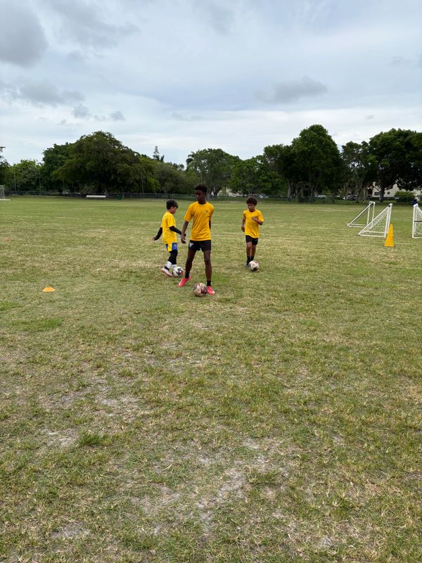 East Florida United players at soccer training camp during a match