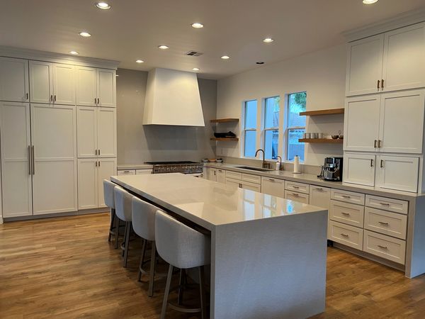 Crown Cabinets: Clearcreek door in Maple wood with Designer White  paint and Wheat stain for Island.