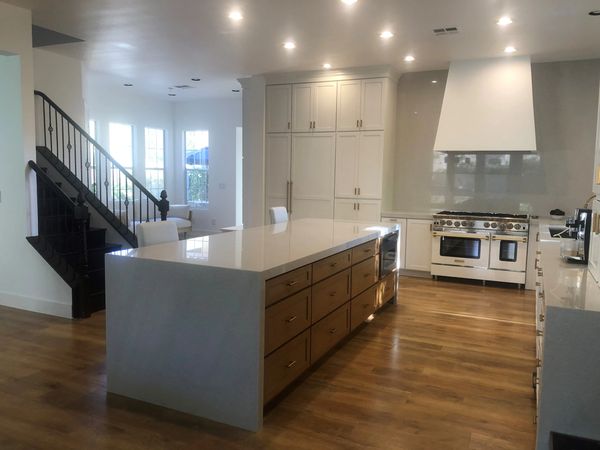 Crown Cabinets: Clearcreek door in Maple wood with Designer White  paint and Wheat stain for Island.