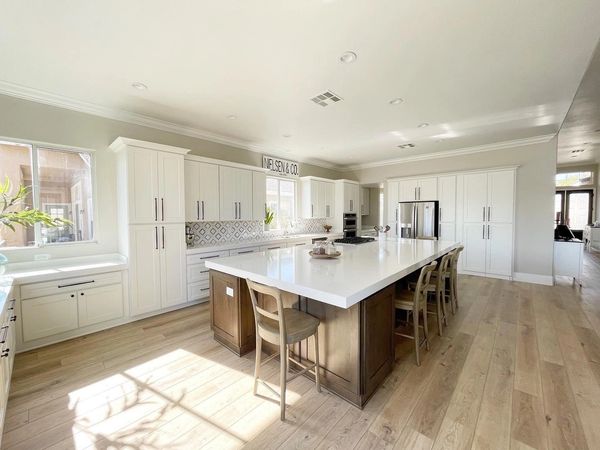 Crown Cabinets: Capri door in Maple wood w/ Designer White paint  & Alder wood with Mushroom/Onyx gl