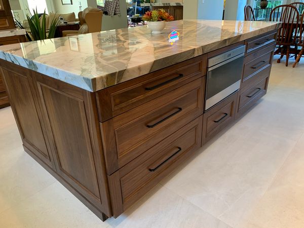 DeWils  Cabinets in Avalon door style in Walnut wood with Nutmeg stain.