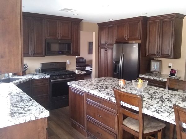 Council's kitchen Crown Cabinets: Solomere door style in Alder wood with Latte stain