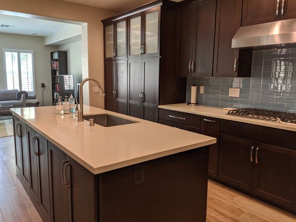 Crown Cabinets: Pioneer door in Alder wood in  Dark Chocolate stain.
Pental  quartz in Taj Mahal.