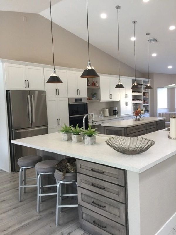 Fashion Cabinets: Shaker door style in PG White paint for perimeter and Shaker door in Maple wood in