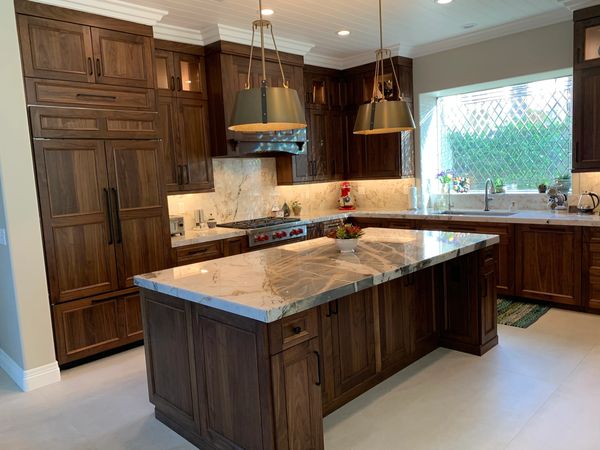 DeWils Cabinets in Avalon door style in Walnut wood with Nutmeg stain.