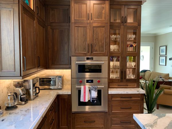 DeWils Cabinets with Avalon door style in Walnut wood and Nutmeg stain.