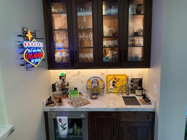 DeWils cabinets with Avalon door style in Walnut wood and Nutmeg stain.