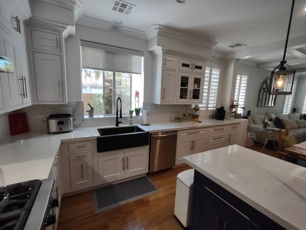 DeWils Cabinets: Avalon door with beaded frame in Just White paint for perimeter and Indigo Blue for