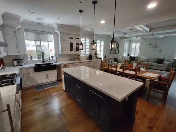 DeWils Cabinets: Avalon door with beaded frame in Just White paint for perimeter and Indigo Blue for