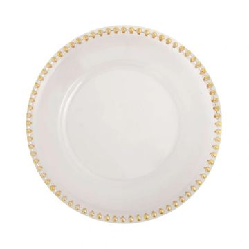Decorative charger plate in the style clear with gold edge.