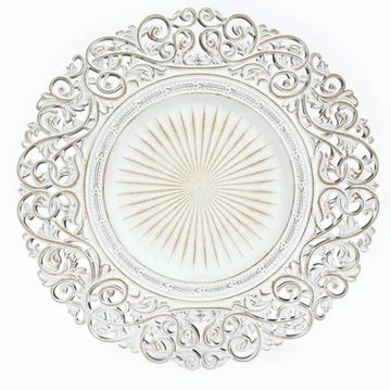 Decorative charger plate in white with carved borders.