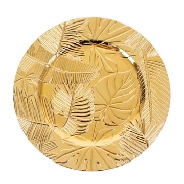 Gold decorative charger plate with tropical leaf pattern. 