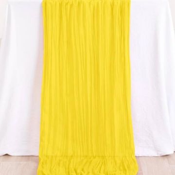 Yellow table runner for wedding and event decor.