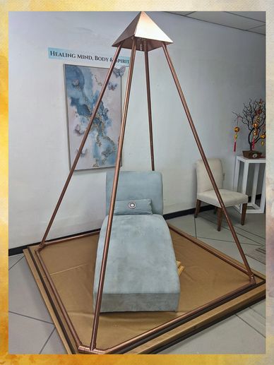 yoga chair inside an eight-foot-tall copper meditation pyramid 