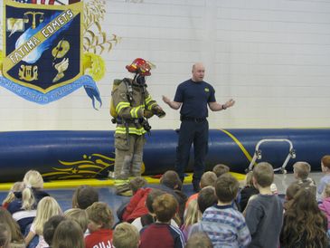 Firefighter demonstration to children at Fatima Comets school.