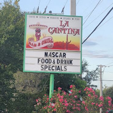 Sign for La Cantina bar and grill with NASCAR specials.