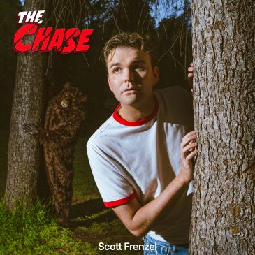 A man hides behind a tree with a creature lurking.