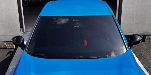 Front view of a blue car.