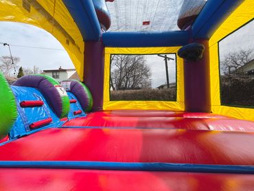 Colorful empty bounce house outside.