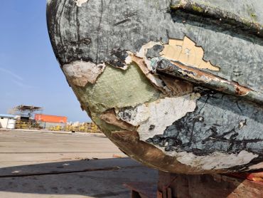 Close-up of peeling and weathered boat hull.
