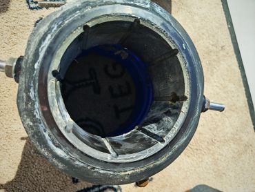 Top view of a metallic industrial component.