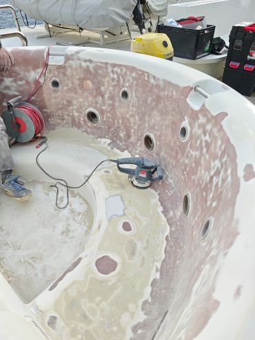 Boat seat being sanded during maintenance.