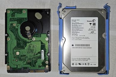 Two 3.5-inch hard drives, one showing the circuit board and the other with the label visible.