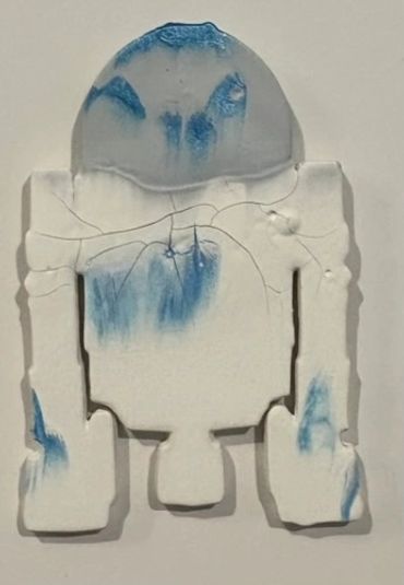 R2D2 with a matte gray top and white bottom, metallic blue spots in both sections