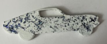 White race car with large dark blue glitter flakes